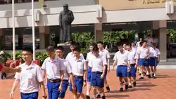 Boy's uniform of Assumption College (Bangkok) with dark blue shorts
