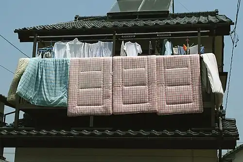 The pink tartan shikibutons are through-quilted; the green kakebutons may be quilted, but seem to still be in their covers.