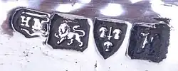 Colour photograph of the hallmarks from a silver inkwell