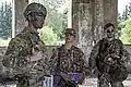 Joint exercise with U.S. Army soldiers in 2017. Woodland, LATPAT and MultiLATPAT (on modular vest) patterns visible.
