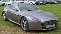 Front three-quarters view of a brown coupe