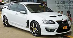 Front three-quarters view of a white sedan