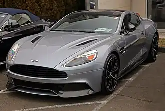 Front three-quarters view of a dark gray coupe