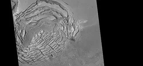 Large group of concentric cracks, as seen by HiRISE, under HiWish program Location is Ismenius Lacus quadrangle. Cracks were formed by a volcano under ice.[16]