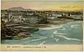 Postcard of a coastal scene with the ocean on the right and a city on the left