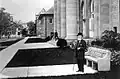 c. about 1915 - Standing near his statue on the Cornell campus
