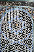 Geometric patterns in zellij tilework at the Al-Attarine Madrasa in Fes (14th century)