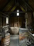 The washhouse and dairy, featuring an 8 metre well