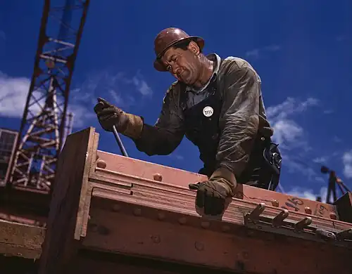 Image 6 Rigger Photo credit: Alfred T. Palmer "Big Pete" Ramagos, rigger at work on Douglas Dam, Tennessee, June 1942. A rigger is a person or company which specializes in the lifting and/or moving of extremely large and/or heavy objects. Riggers use equipment expressly designed for moving and lifting objects where ordinary material handling equipment cannot go. More selected pictures