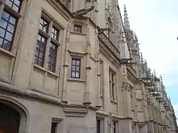 Detail of the alignment of gargoyles on the neo-Gothic facade of rue aux Juifs (late 19th century).