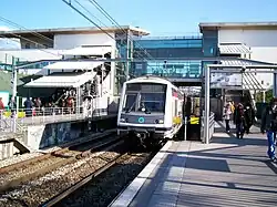 A train (MI2N) arriving at the station (towards Paris)