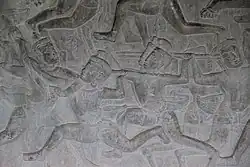 Elbow to the jaw pass the arm shield. Bas-relief located at Angkor Wat (1100s)