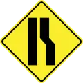 Road narrows on the right side