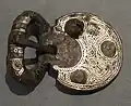 Belt buckle with faces, iron with silver inlay
