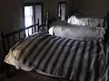 Strangers commonly shared a bed, sleeping in reverse positions.