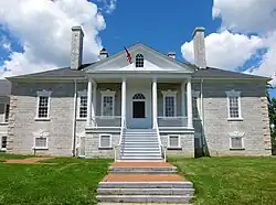 stately-looking large house of gray brick