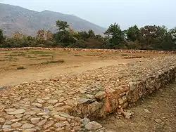 Bimbisara's jail, where King Bimbisara was imprisoned by his son Ajatashatru, in Rajgir.