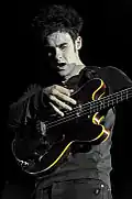 Color photograph of Robert Levon Been of Black Rebel Motorcycle Club performing live in 2010
