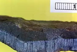 Blue asbestos (crocidolite); the ruler is 1&nbsp;cm
