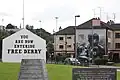 View of the corner from the Hunger Strike memorial, showing the "petrol bomber" mural.
