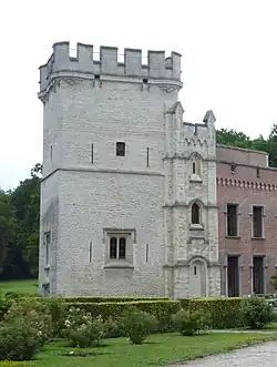 The Donjon Tower of Bouchout Castle, 20 m (66 ft) in height and strong walls 1 m (3.3 ft) thick. It was built c. 1300 by knight Daniel van Bouchout