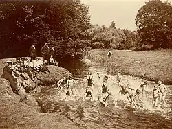 Boys nude and girls in suits - 1910