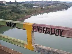The exact border point along the bridge.