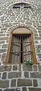 A capiz shell window on a side tower of the Taal Basilica in Taal, Batangas