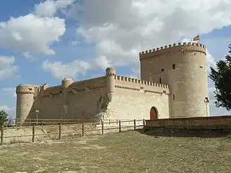 View of the castle of Arévalo, with a Spanish flag raised