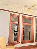 Handpainted ceiling details and leaded glass inside the former El Miradero mansion.
