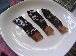 Chocolate-covered bacon, dipped in chocolate ganache