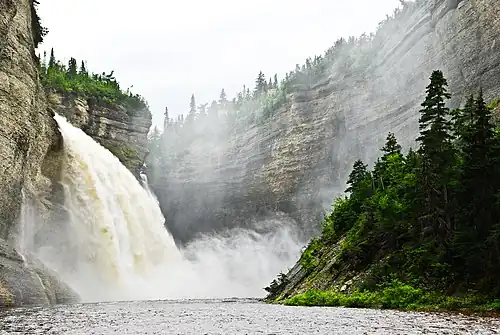 Cliff wall, fall and Vauréal River[37]