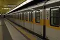 Coat of arms of Milan on the sides of an electric subway line 3 train.