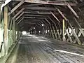(image 6 of 9) 2018 Viewed from the Cornish side. The lattices are the diagonal beams on the sides attached to the chords (horizontal beams running, lengthwise, parallel to the floor planks); from top to bottom – the primary upper chord, the secondary upper chord, the secondary lower chord, and the primary lower chord.