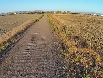 Coarse-grained soil particles on a gravel road in Fremont, California