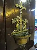A brass stoup for holy water