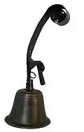 Antique mechanically operated shop doorbell on a torsion spring