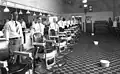 Staff of Draper's Barber Shop, Franklin Street, Martinsville, 1920. White bowls on floor are spittoons[192]
