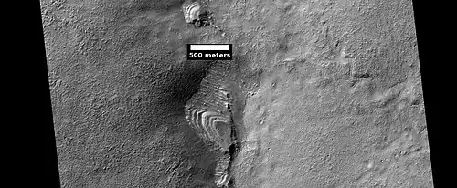 Layered feature of unknown origin. HiRISE image.