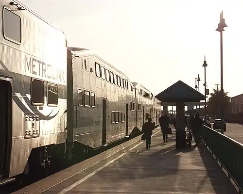 A train at East Ventura station at sunset