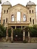 Facade of the ruined Synagogue before restoration