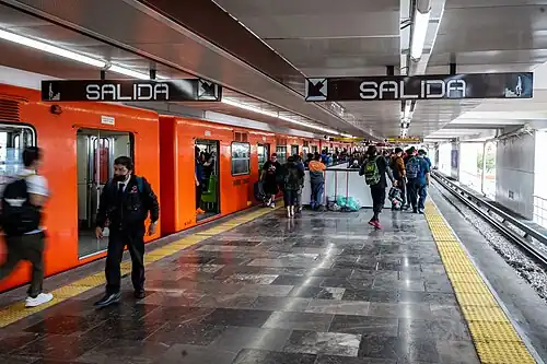 Picture of people wating and leaving at the platforms.