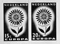 1964: Flower with 22 petals. 1 petal for each 1964 member. Designed by Georges Betemps of France.