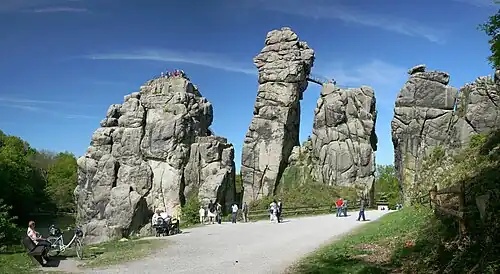 Image 12 Externsteine Photo credit: Daniel Schwen The Externsteine, a distinctive rock formation located in the Teutoburger Wald region of northwestern Germany, are a popular tourist attraction. Stairs and a small bridge connecting two of the rocks lead to the top.