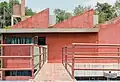 A bridge connects the two divisions of the Rivera-Kahlo house