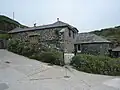 Fish cellars at Church Cove, England, used for pressing salted pilchards into barrels for storage and export to the continent