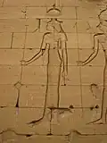 Relief of a woman in Egyptian clothing with an elaborate headdress