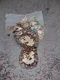 The foot imprint at Big foot museum is often adorned with money.
