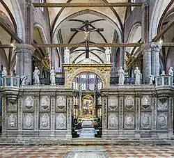The painting seen through the arch in the choir-screen