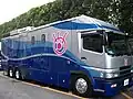 Fuji TV OB van with the eyeball logo colored in pink.